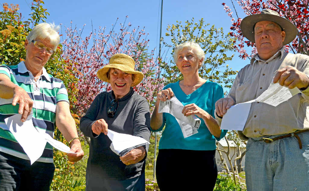 LITTLE RIPPER: Warner St residents Margaret Collins, Kate Keogh, Raylene Swain and Allan Smith are relieved they can tear up their supplementary rates notices, after council unanimously voted to drop the charges on Thursday. LITTLE RIPPER: Warner St residents Margaret Collins, Kate Keogh, Raylene Swain and Allan Smith are relieved they can tear up their supplementary rates notices, after council unanimously voted to drop the charges on Thursday.